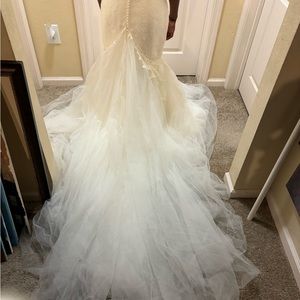 New cream wedding dress. Pearled zipper detailing and beautiful lace detailing.